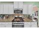 A chef's kitchen featuring gas cooktop and granite counters at 226 Creek View Ln, Acworth, GA 30102