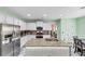 Modern kitchen with white cabinets, granite countertops, and stainless steel appliances at 226 Creek View Ln, Acworth, GA 30102