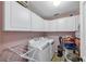 Functional laundry room with cabinets and modern washer and dryer at 226 Creek View Ln, Acworth, GA 30102