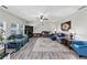 Spacious living room features with multiple seating arrangements and a large-screen television at 226 Creek View Ln, Acworth, GA 30102