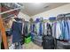 Well-organized walk-in closet featuring metal shelving units with ample storage space for clothes and accessories at 226 Creek View Ln, Acworth, GA 30102