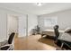 Bright bedroom features a bed, desk and chair near a window and a light wood floor at 2734 Bell Se Dr, Smyrna, GA 30080