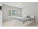 Bright bedroom with ample natural light, neutral paint and a contemporary bed at 2734 Bell Se Dr, Smyrna, GA 30080