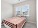 Bright bedroom with two windows and neutral decor at 2734 Bell Se Dr, Smyrna, GA 30080