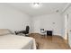 Bedroom featuring a bed, desk and chair near a window and a light wood floor at 2734 Bell Se Dr, Smyrna, GA 30080