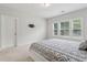 Comfortable bedroom featuring natural light, carpeted floors, and pre-installed TV mount at 2734 Bell Se Dr, Smyrna, GA 30080