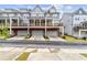 View of townhouses featuring private balconies over garages along a neighborhood street at 2734 Bell Se Dr, Smyrna, GA 30080
