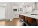 Modern kitchen boasting a center island with bar stools, stainless steel appliances, and white cabinetry at 2734 Bell Se Dr, Smyrna, GA 30080