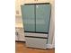 Unique stainless steel refrigerator with white paneled doors complements the modern kitchen design at 2734 Bell Se Dr, Smyrna, GA 30080
