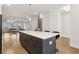 Spacious kitchen featuring a large island with seating, stainless steel appliances, and hardwood floors at 2734 Bell Se Dr, Smyrna, GA 30080