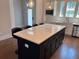 Bright kitchen with an island, quartz countertops, stainless steel appliances, and pendant lighting, perfect for entertaining at 2734 Bell Se Dr, Smyrna, GA 30080
