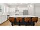Modern kitchen boasting a center island with bar stools, stainless steel appliances, and white cabinetry at 2734 Bell Se Dr, Smyrna, GA 30080