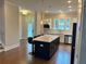 Open-concept kitchen featuring a spacious island, stainless steel appliances, and ample cabinet space, ideal for cooking at 2734 Bell Se Dr, Smyrna, GA 30080