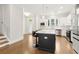 Spacious kitchen featuring a large center island, stainless steel appliances, and hardwood floors at 2734 Bell Se Dr, Smyrna, GA 30080