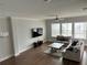 Spacious living room with hardwood floors, lots of windows, and comfortable seating at 2734 Bell Se Dr, Smyrna, GA 30080