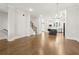 Open floor plan featuring hardwood floors, staircase, and a view of the kitchen at 2734 Bell Se Dr, Smyrna, GA 30080