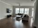 Spacious living room with hardwood floors, lots of windows, and comfortable seating at 2734 Bell Se Dr, Smyrna, GA 30080