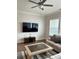 Cozy living room with hardwood floors, ceiling fan, and mounted television at 2734 Bell Se Dr, Smyrna, GA 30080