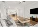 Open-concept living room with hardwood floors seamlessly connecting to a modern kitchen at 2734 Bell Se Dr, Smyrna, GA 30080