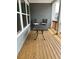 Covered patio features wooden floors, gray siding, and outdoor furniture at 2734 Bell Se Dr, Smyrna, GA 30080