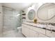 Modern bathroom boasts double sinks, granite countertops, and a glass-enclosed shower at 3850 Beya Way, Atlanta, GA 30340