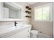 Bright bathroom with modern vanity, floating shelves, and subway tile shower, perfect for relaxation at 3850 Beya Way, Atlanta, GA 30340