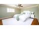 Inviting bedroom with hardwood floors, ceiling fan, and a plush rug at 3850 Beya Way, Atlanta, GA 30340