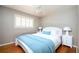 Charming bedroom with wood floors, ample natural light, and a ceiling fan, offering cozy comfort at 3850 Beya Way, Atlanta, GA 30340