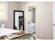 Bright bedroom with closet and ensuite bathroom featuring modern fixtures and stylish decor at 3850 Beya Way, Atlanta, GA 30340
