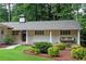 Inviting front porch with swing and manicured landscaping at 3850 Beya Way, Atlanta, GA 30340