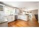 Spacious kitchen with stainless steel appliances, white cabinets, granite countertops, and an open layout perfect for entertaining at 3850 Beya Way, Atlanta, GA 30340