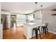 A modern kitchen featuring white cabinets, stainless steel appliances, granite countertops, with hardwood floors at 3850 Beya Way, Atlanta, GA 30340