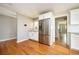 Modern kitchen featuring stainless steel appliances, white cabinetry, granite countertops, and hardwood floors, offering a functional design at 3850 Beya Way, Atlanta, GA 30340