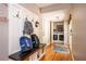 Functional mudroom with built-in bench, hooks, and view of the laundry area, creating an organized entrance at 3850 Beya Way, Atlanta, GA 30340