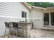 Stylish outdoor bar featuring stone accents, seating, and a seamless transition to the backyard space at 3850 Beya Way, Atlanta, GA 30340