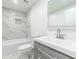 This elegant bathroom features marble-style shower tiles, a modern vanity, and a bright mirror at 4922 Glenside Ct, Stone Mountain, GA 30088