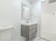 This bathroom has an updated vanity and a clean white color palette at 4922 Glenside Ct, Stone Mountain, GA 30088
