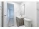 Bathroom features updated vanity, modern fixtures and door to other room at 4922 Glenside Ct, Stone Mountain, GA 30088