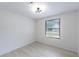 Bright bedroom offers hardwood flooring, large window, and updated light fixture at 4922 Glenside Ct, Stone Mountain, GA 30088