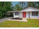 Close-up of the house showcasing its welcoming red front door and cozy front porch at 4922 Glenside Ct, Stone Mountain, GA 30088
