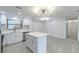 Bright kitchen featuring a center island, modern appliances, and a large window at 4922 Glenside Ct, Stone Mountain, GA 30088