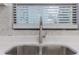 Modern kitchen sink with faucet, white countertops and subway tile backsplash at 4922 Glenside Ct, Stone Mountain, GA 30088