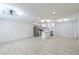 Open-concept living area with updated flooring, modern lighting, and stainless steel appliances at 4922 Glenside Ct, Stone Mountain, GA 30088