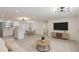 Bright open layout with kitchen, stainless appliances, dining area, and a comfortable living space at 4922 Glenside Ct, Stone Mountain, GA 30088