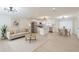 Bright, open-concept kitchen featuring modern appliances, white cabinetry, and an island with seating at 4922 Glenside Ct, Stone Mountain, GA 30088