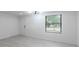 Living room featuring new flooring, lots of sunlight, and an exterior view at 4922 Glenside Ct, Stone Mountain, GA 30088