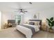 Comfortable main bedroom with a ceiling fan and coordinated bedside lamps at 4922 Glenside Ct, Stone Mountain, GA 30088
