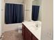 Bathroom featuring a vanity and shower with dark blue shower curtain at 210 Morning Dove Ln, Suwanee, GA 30024