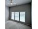 Bedroom with carpet, ample light from large windows, and a ceiling fan at 210 Morning Dove Ln, Suwanee, GA 30024