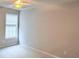 Bright carpeted bedroom with a ceiling fan and window providing natural light at 210 Morning Dove Ln, Suwanee, GA 30024